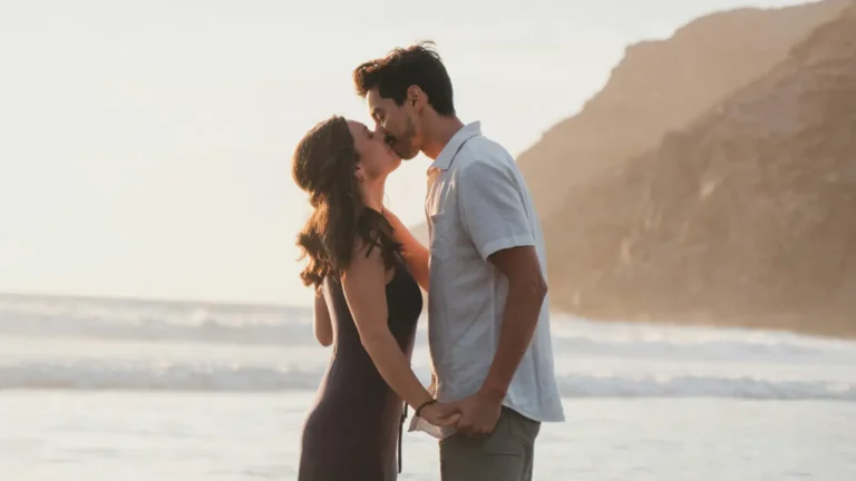 Couple standing on the beach at sunset with Start Quiz button for relationship compatibility test