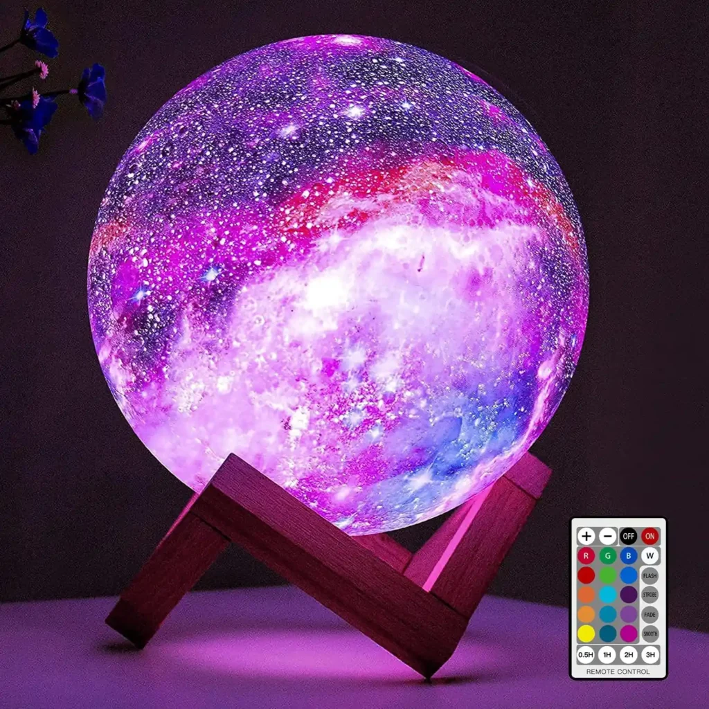 Moon-shaped lamp on a wooden stand glowing purple with star projections in a dark room, featuring a remote control, perfect for creating a magical and cozy ambiance