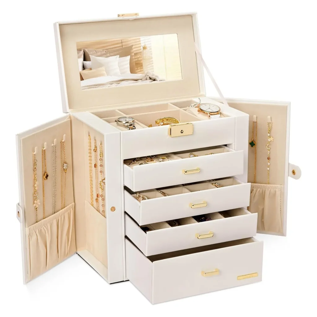 Tall white jewelry box with open lid revealing multiple beige velvet compartments filled with gold jewelry and a built-in mirror, perfect for organizing and displaying accessories in style