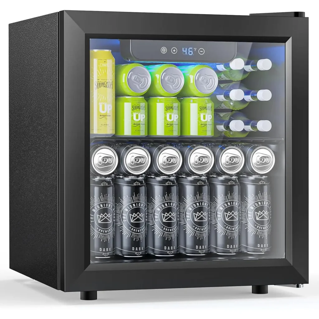 Black mini fridge with transparent glass door, filled with soda cans and drinks, standing on a white background, perfect for keeping beverages cool at home or office.