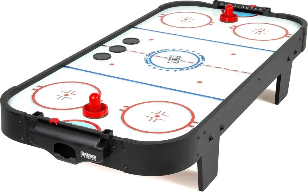Black and white mini air hockey table on a white background, compact and portable for tabletop play, perfect for kids and adults to enjoy fast-paced fun at home or in the office.